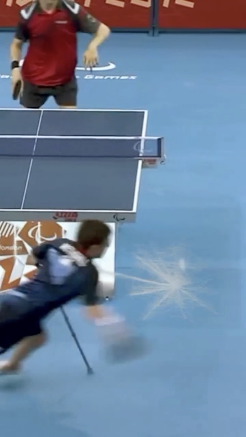 David diving full-stretch to return a shot at the London 2012 Paralympic Games